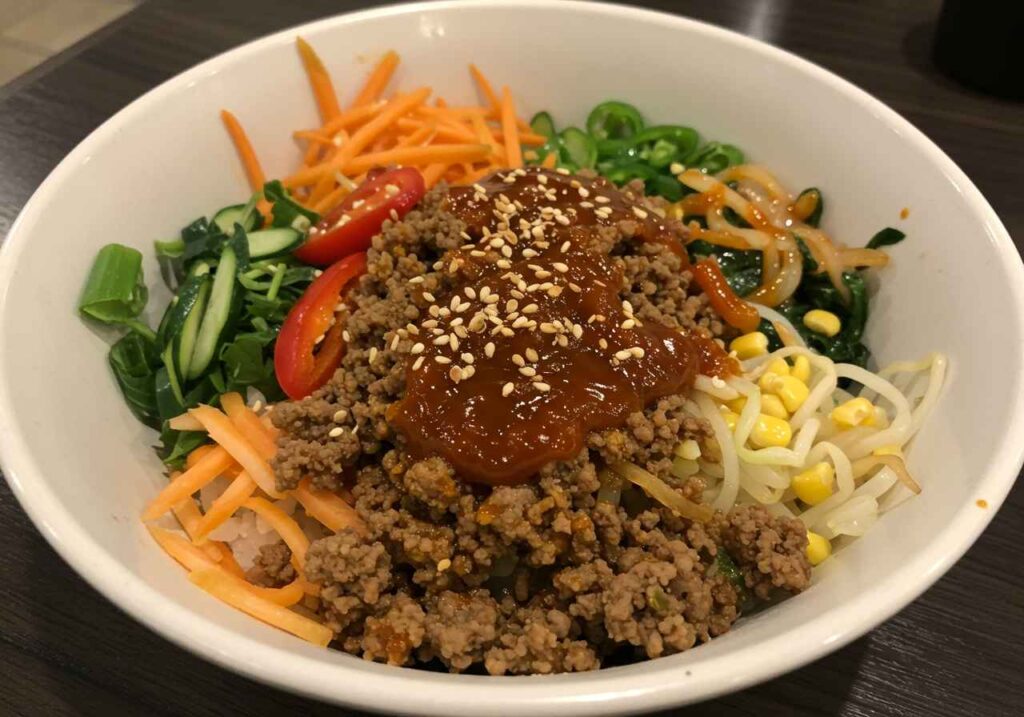 korean ground beef bowl with rice and green onions